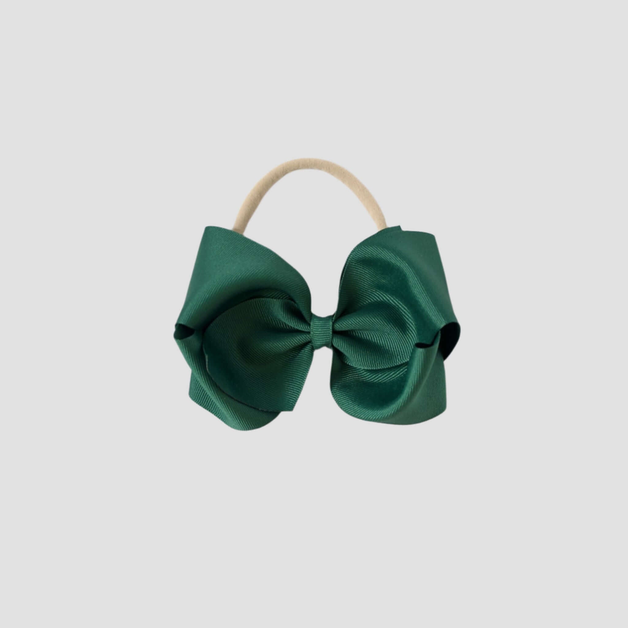 5 inch Grosgrain Penelope hair bow Headband in forest green on a white background