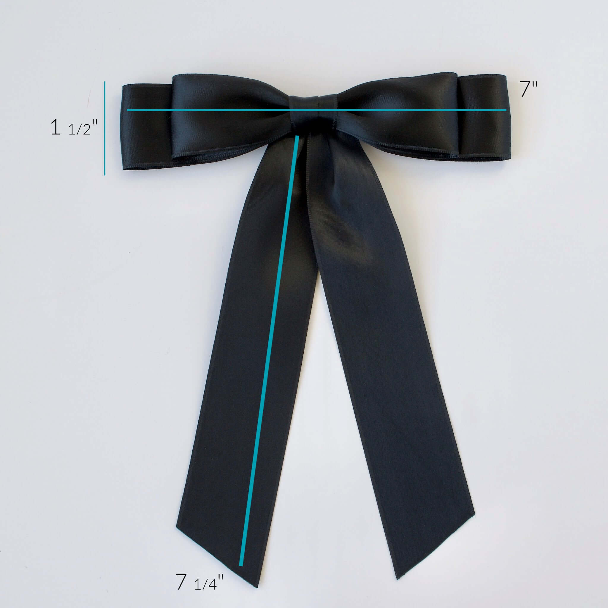 Handmade satin hair bow in black – elegant accessory for women and girls.