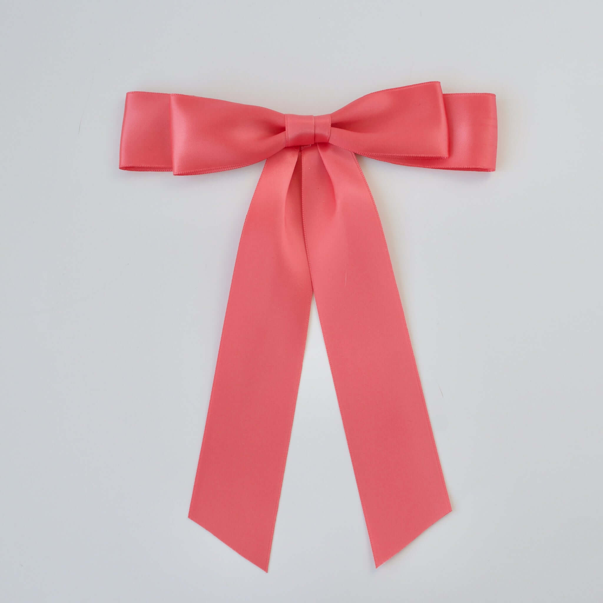 Pink coral hair bow with metal clip – soft and dainty accessory for 2025 summertime