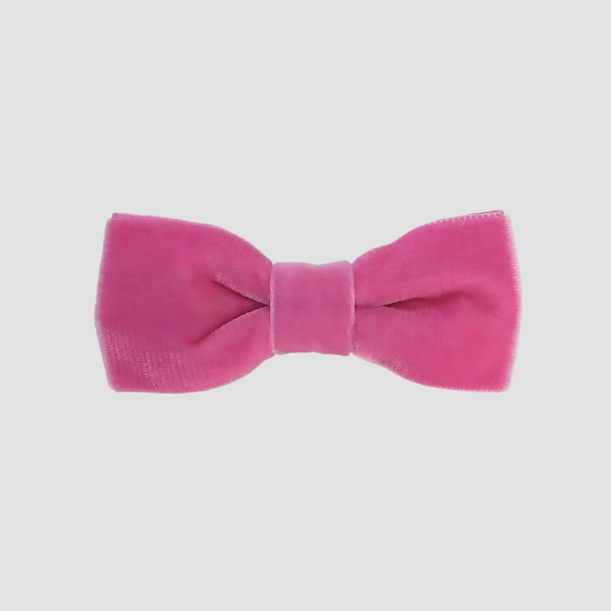 0-24 mos Hor Pink velvet bow tie on a white background