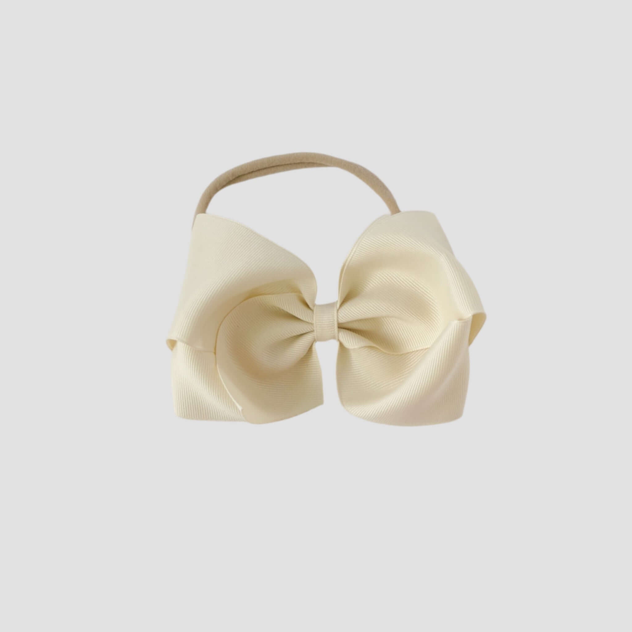 5 inch Grosgrain Penelope hair bow Headband in ivory on a white background