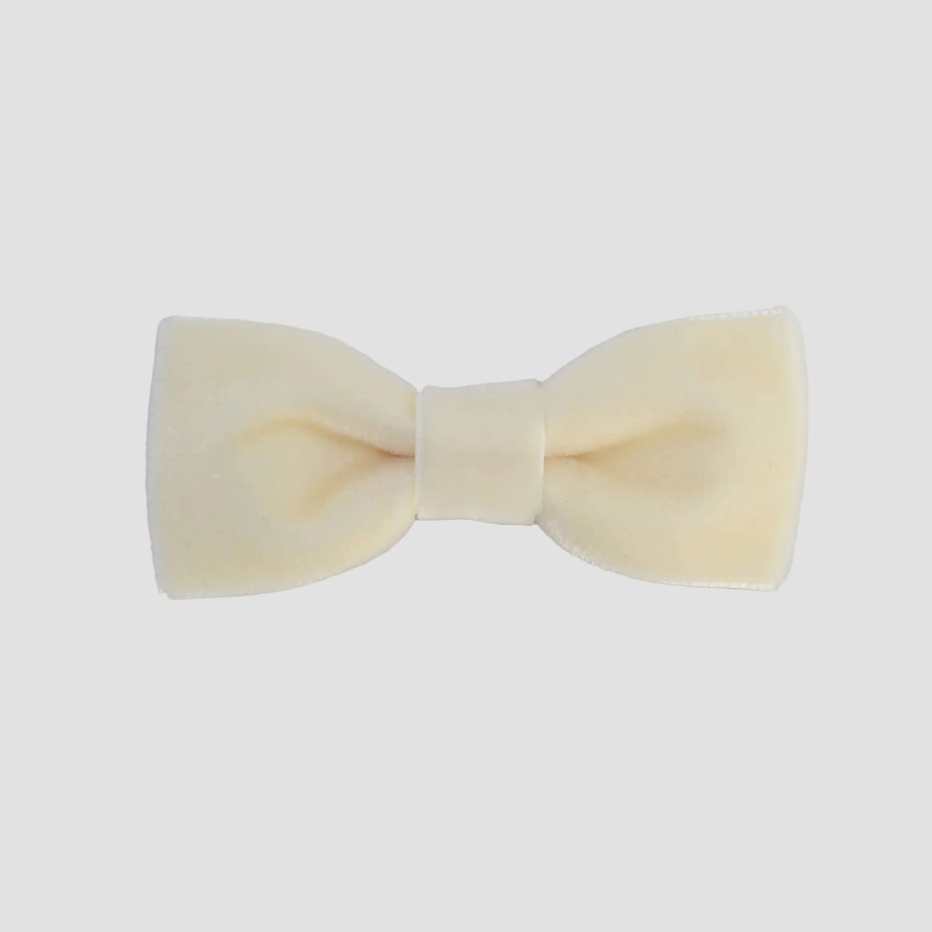 0-24 mos Ivory velvet bow tie on a white background