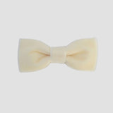 0-24 mos Ivory velvet bow tie on a white background