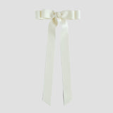 Ivory bow with long tails on a white background