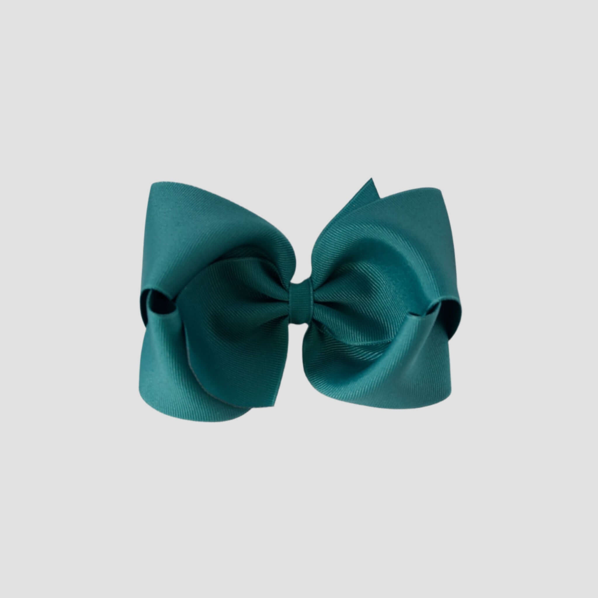 Jade green hair bow on a white background