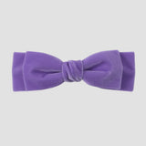 Lavender purple velvet hair bow on a white background