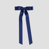 Light navy bow with long ribbons on a white background