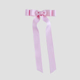 Light pink grosgrain ribbon bow on a white background