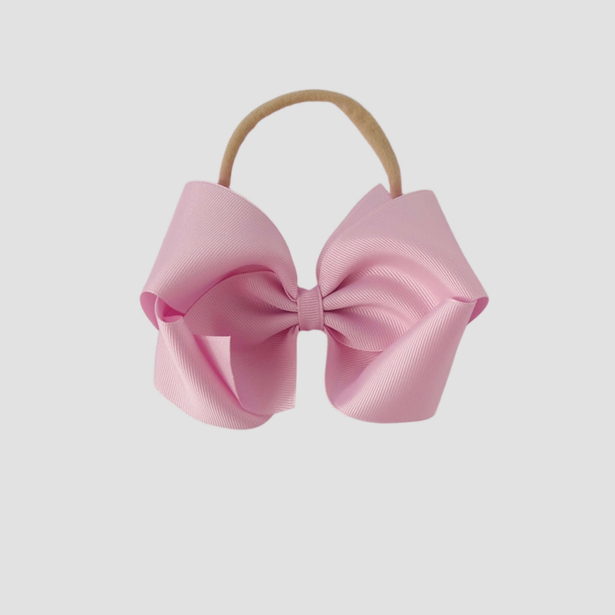 5 inch Grosgrain Penelope hair bow Headband in light pink on a white background