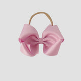 5 inch Grosgrain Penelope hair bow Headband in light pink on a white background
