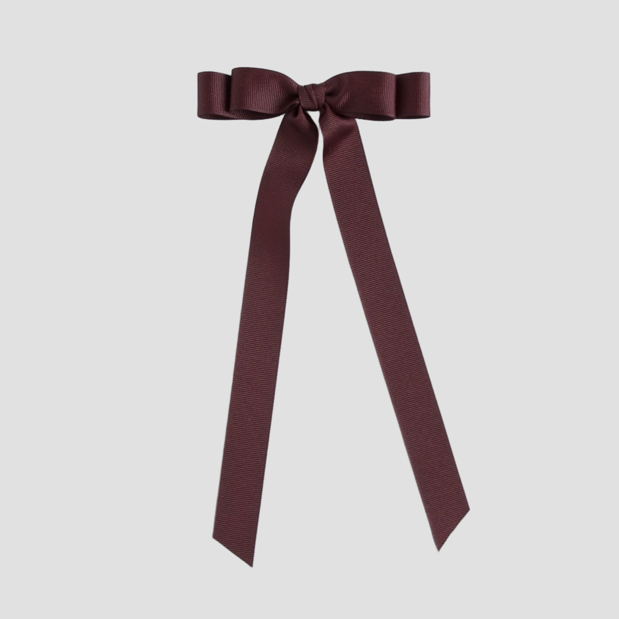 Maroon ribbon bow on a white background