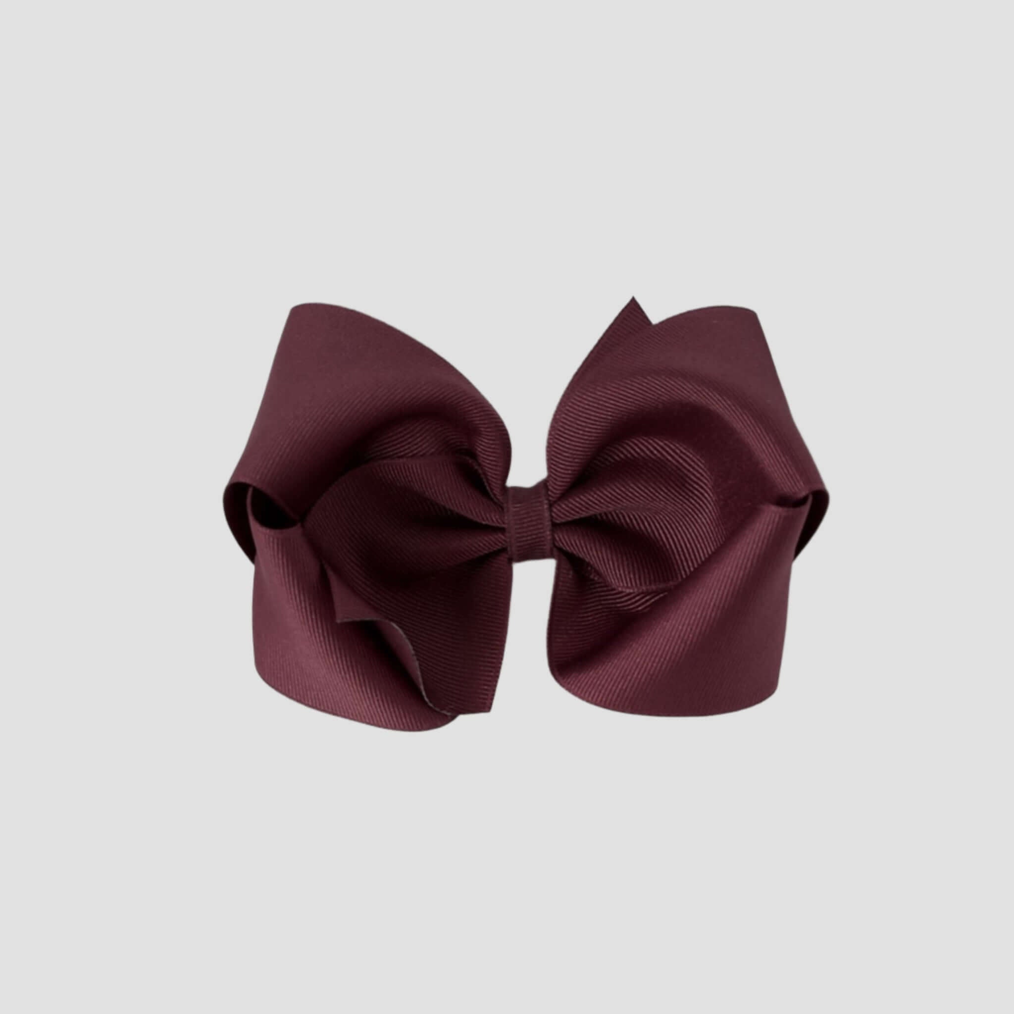 Maroon hair bow on a white background