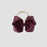 Maroon hair bow on a white background