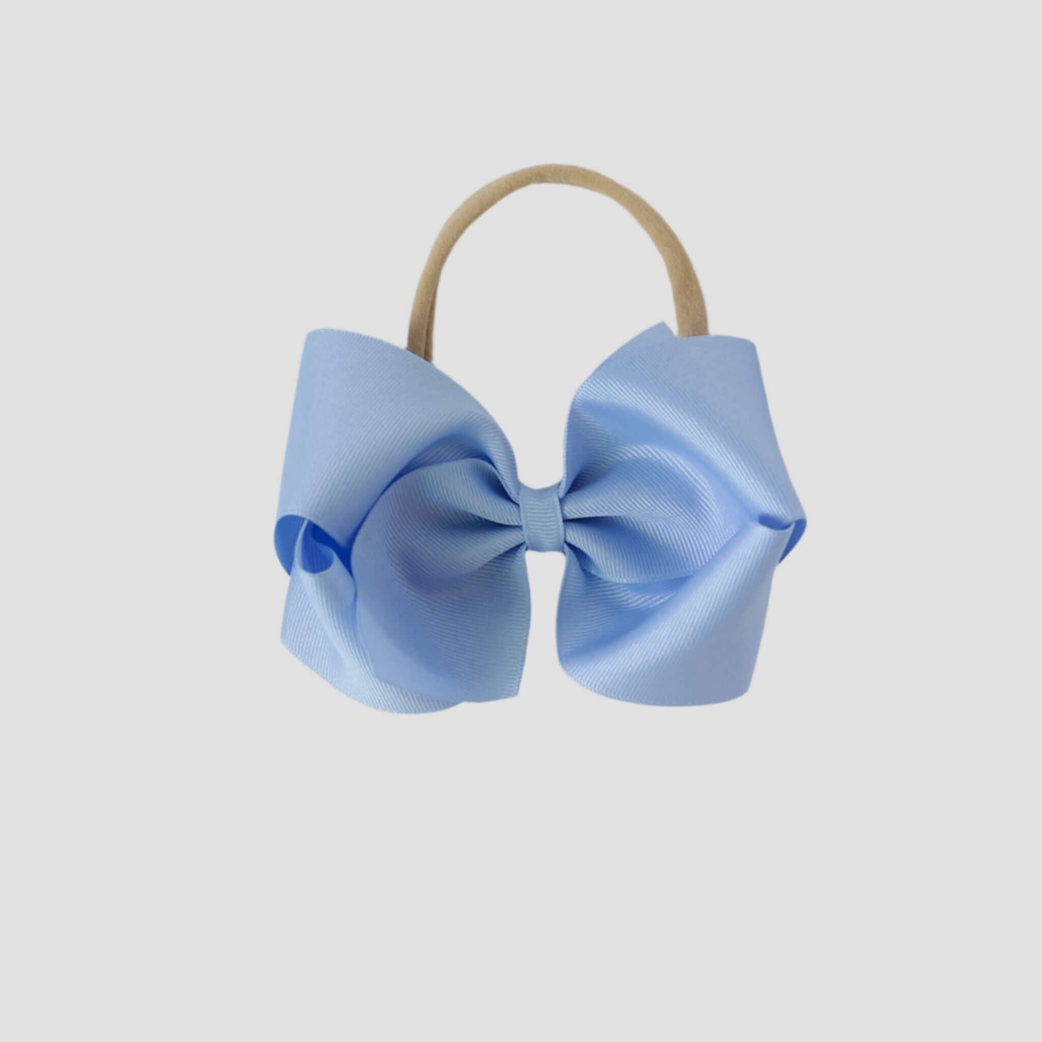 Light blue hair bow on a white background