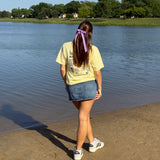Girls standing at a beach wearing dark orchid grosgrain Bailee bow