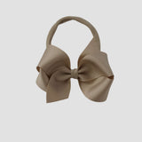 Oatmeal 4 inch Penelope grosgrain bow on a nude nylon headband