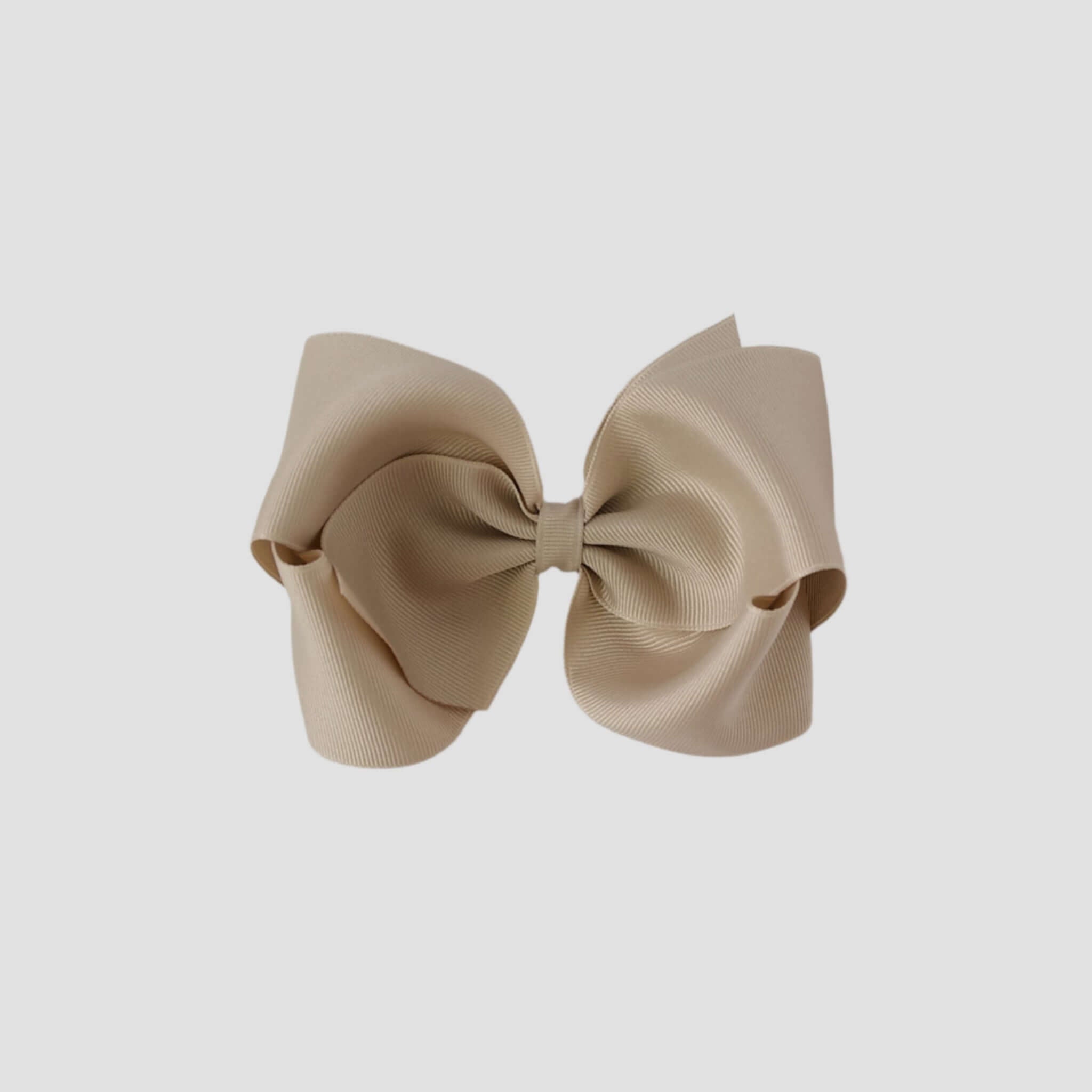 Oatmeal hair bow on a white background
