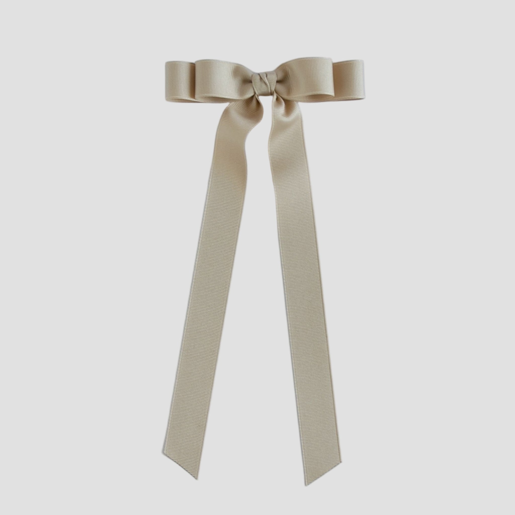 Oatmeal beige Bailee ribbon bow on a white background