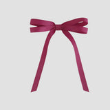 Azalea grosgrain ribbon bow on a white background