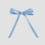 Light blue ribbon bow on a white background