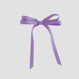 Dark orchid purple grosgrain ribbon bow on a white background
