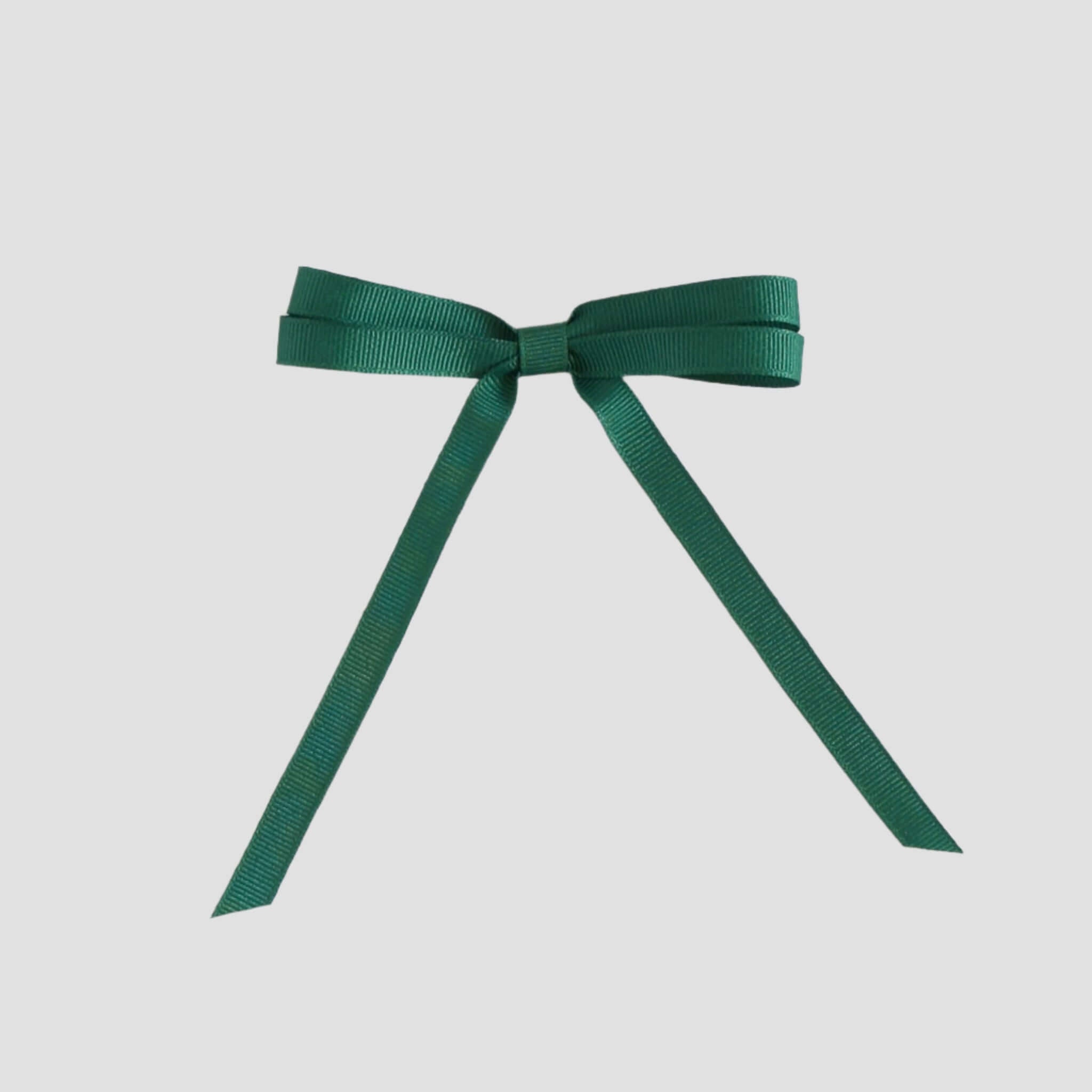 Forest green grosgrain ribbon bow on a white background
