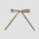 Oatmeal grosgrain ribbon bow on a white background
