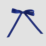 Royal blue ribbon bow on a white background