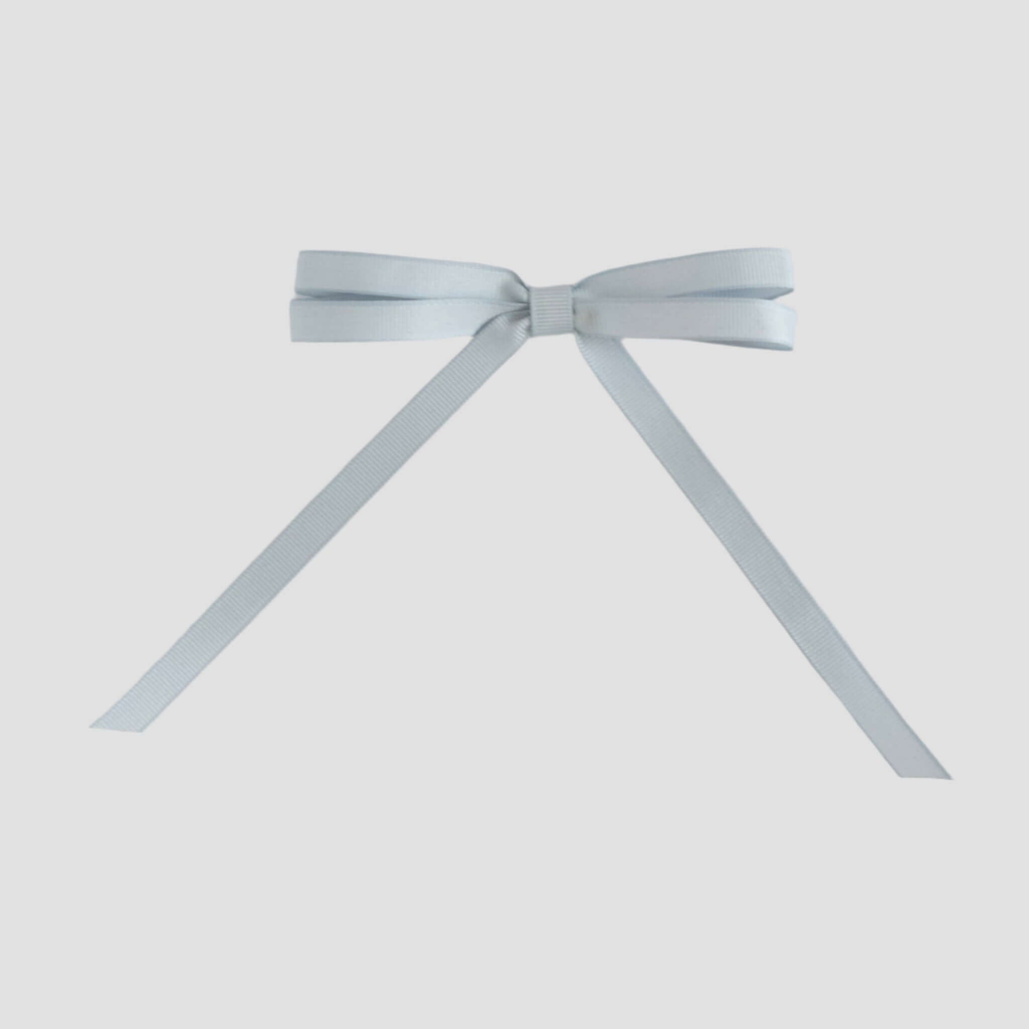 Silver grosgrain ribbon bow on a white background