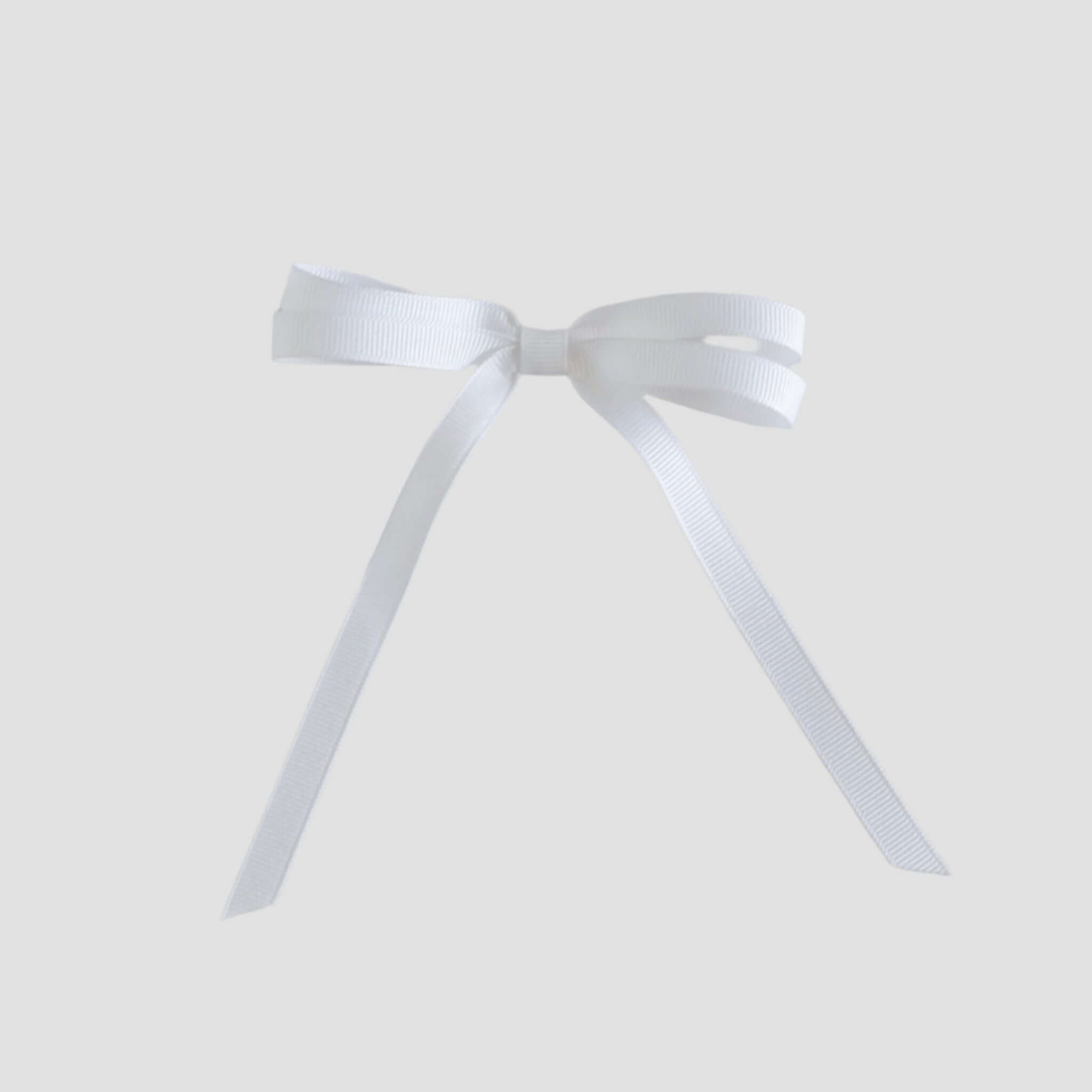 White ribbon bow on a white background
