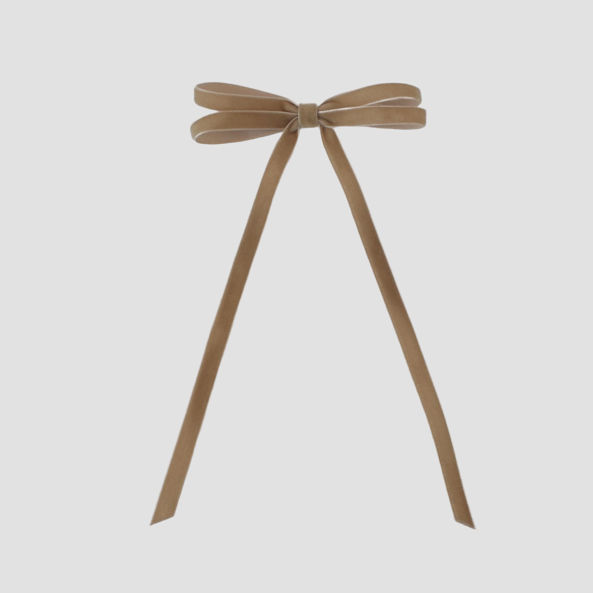 Taupe velvet hair bow on a white background