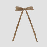 Taupe velvet hair bow on a white background
