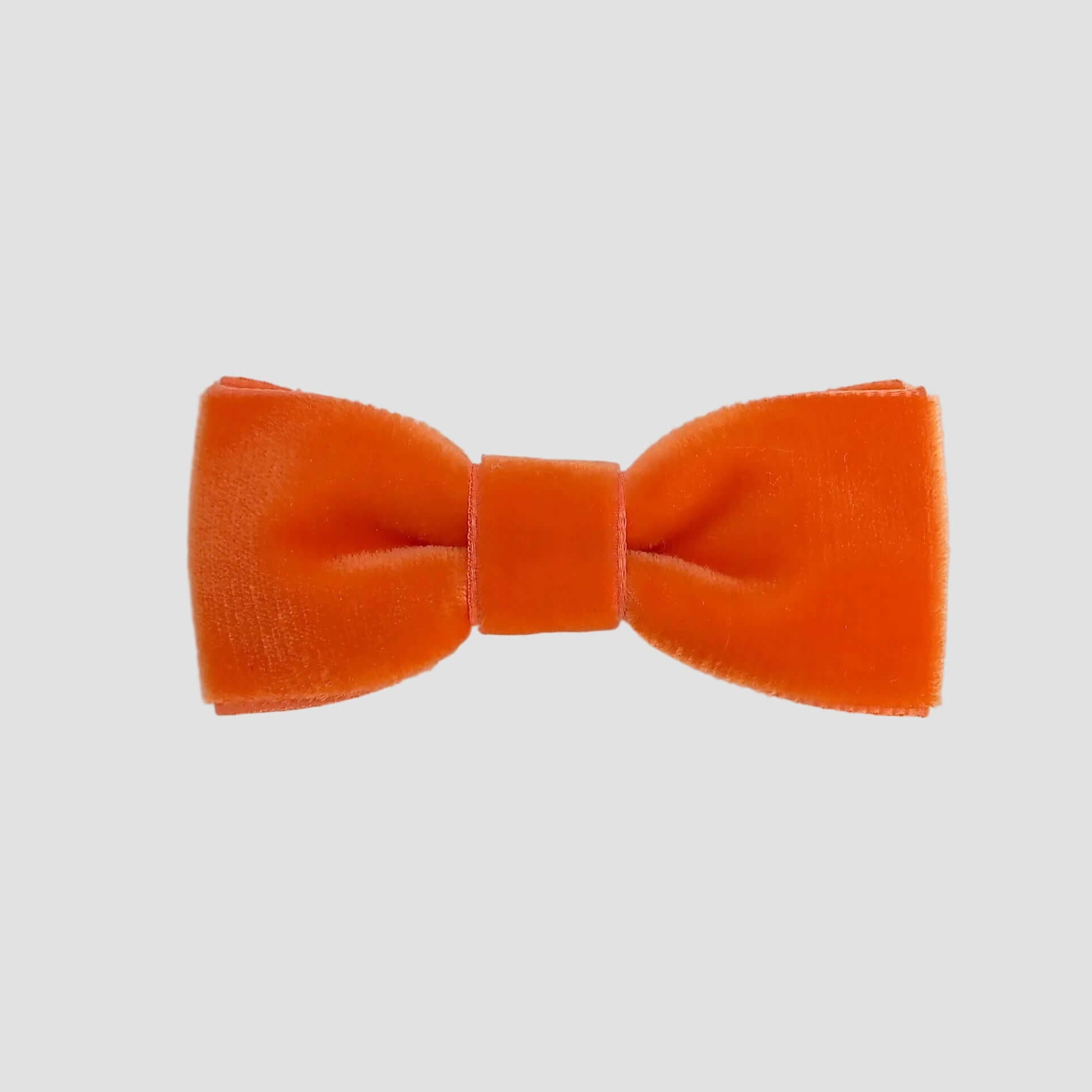 0-24 mos Orange velvet bow tie on a white background