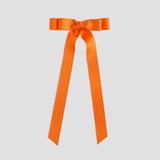 Orange ribbon bow on a white background