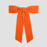 Orange Zoe petite velvet hair bow on a white background.