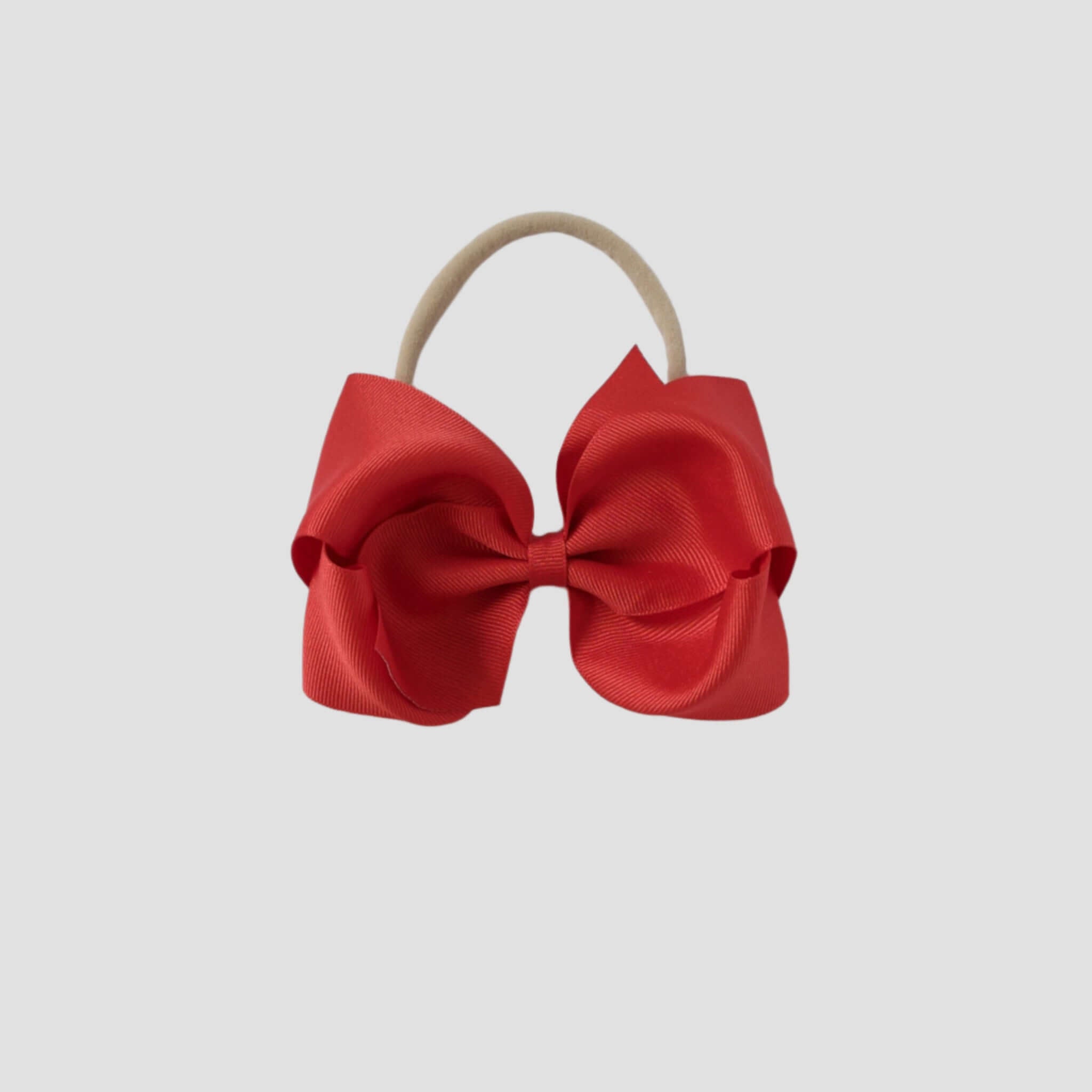 5 inch Grosgrain Penelope hair bow Headband in red on a white background