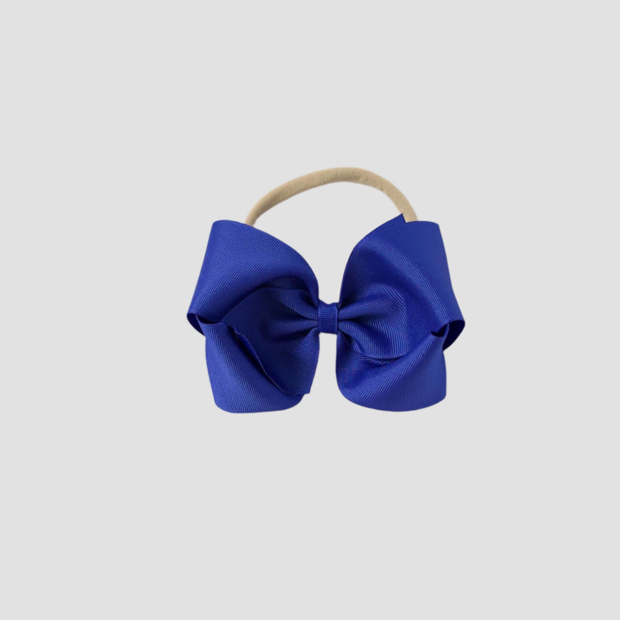 5 inch Grosgrain Penelope hair bow Headband in royal blue on a white background