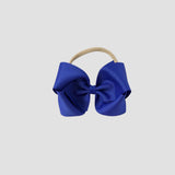5 inch Grosgrain Penelope hair bow Headband in royal blue on a white background