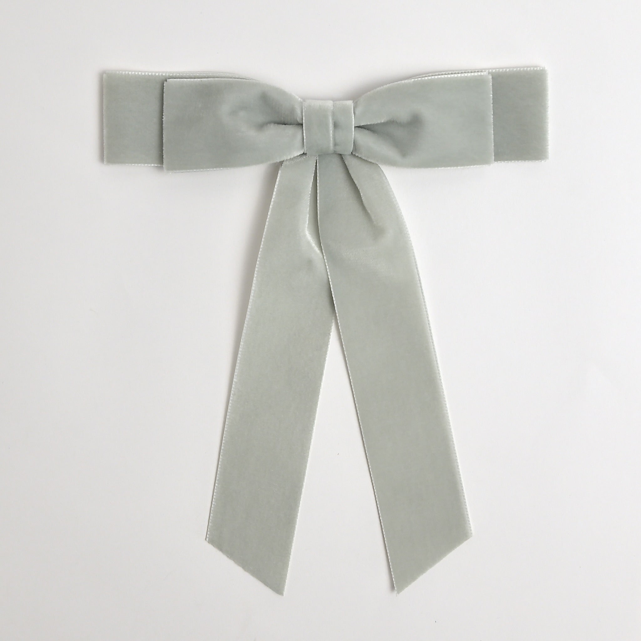 Silver gray Grace velvet hair bow for women. Double bow with long tails on white background 