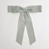 Silver gray Grace velvet hair bow for women. Double bow with long tails on white background 
