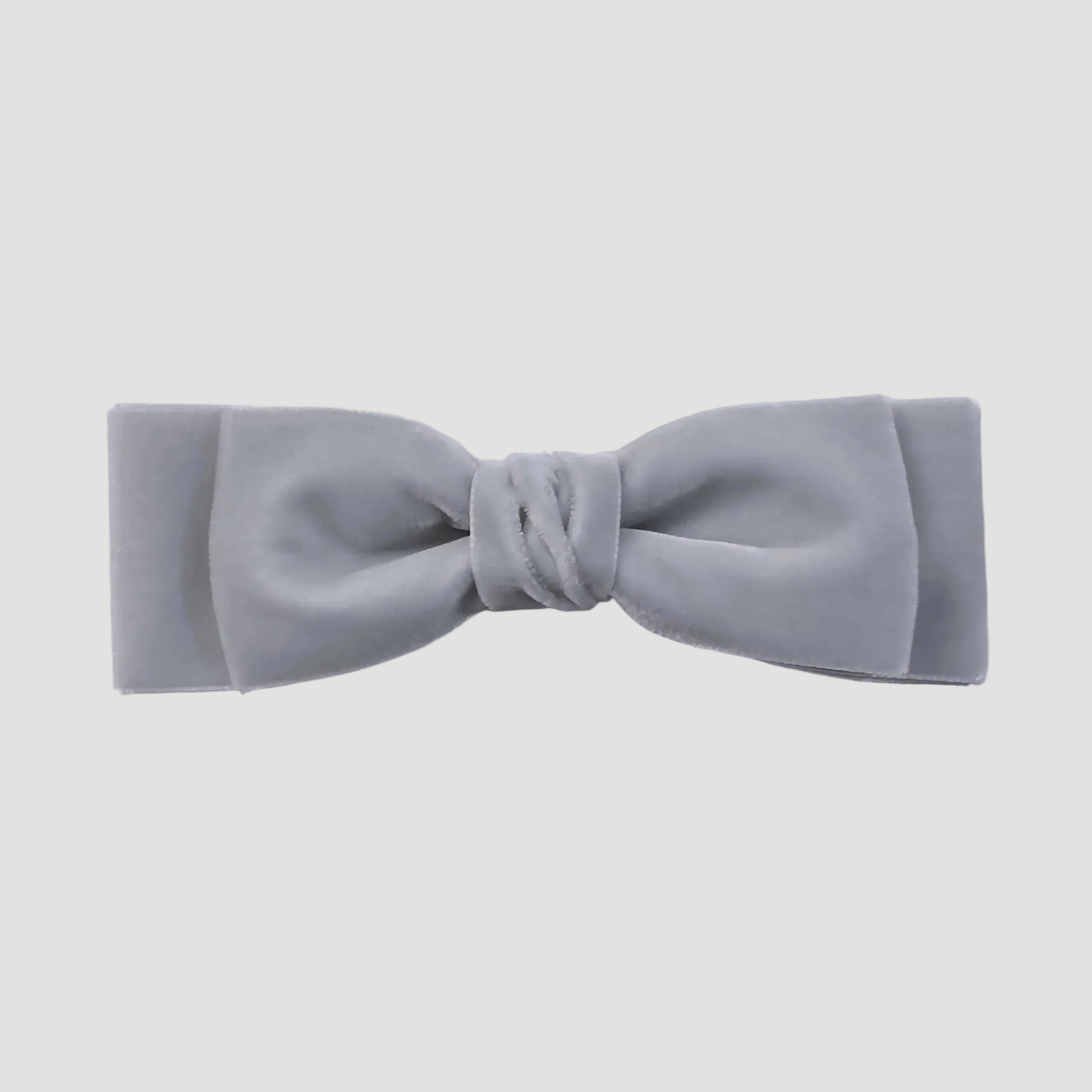 Silver gray velvet hair bow on a white background