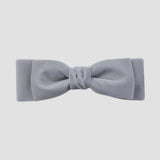 Silver gray velvet hair bow on a white background