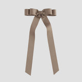 Taupe brown ribbon bow on a white background