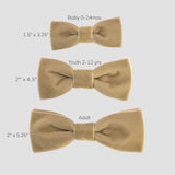 Comparison for baby, youth and men's bow ties on a white background.
