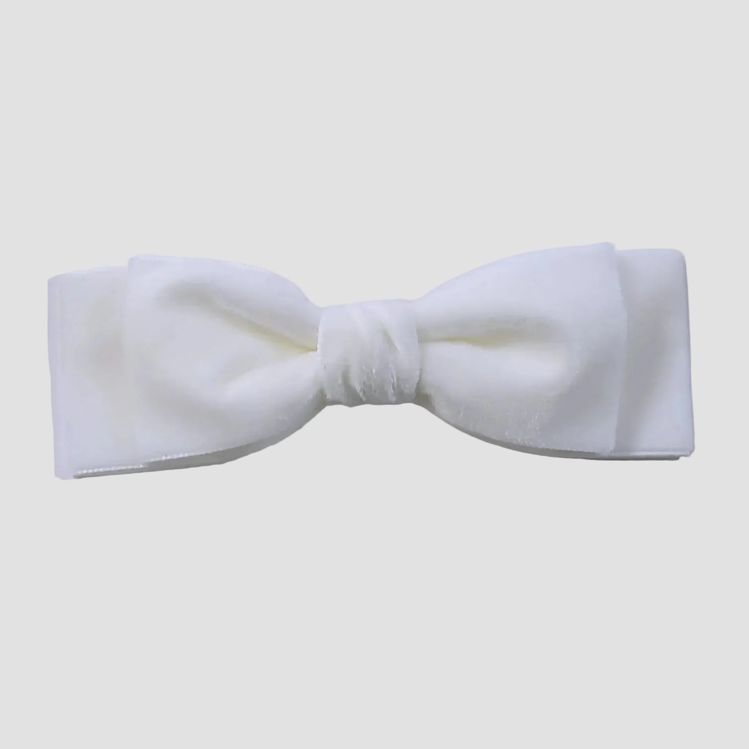 White velvet hair  bow on a white  background