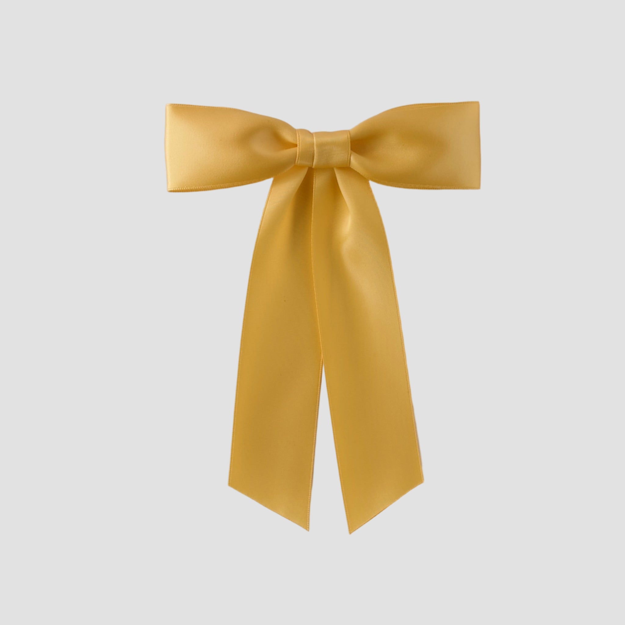 Golden Yellow Zoe petite satin hair bow on a white background
