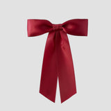 Dark red Zoe petite satin hair bow on a white background 