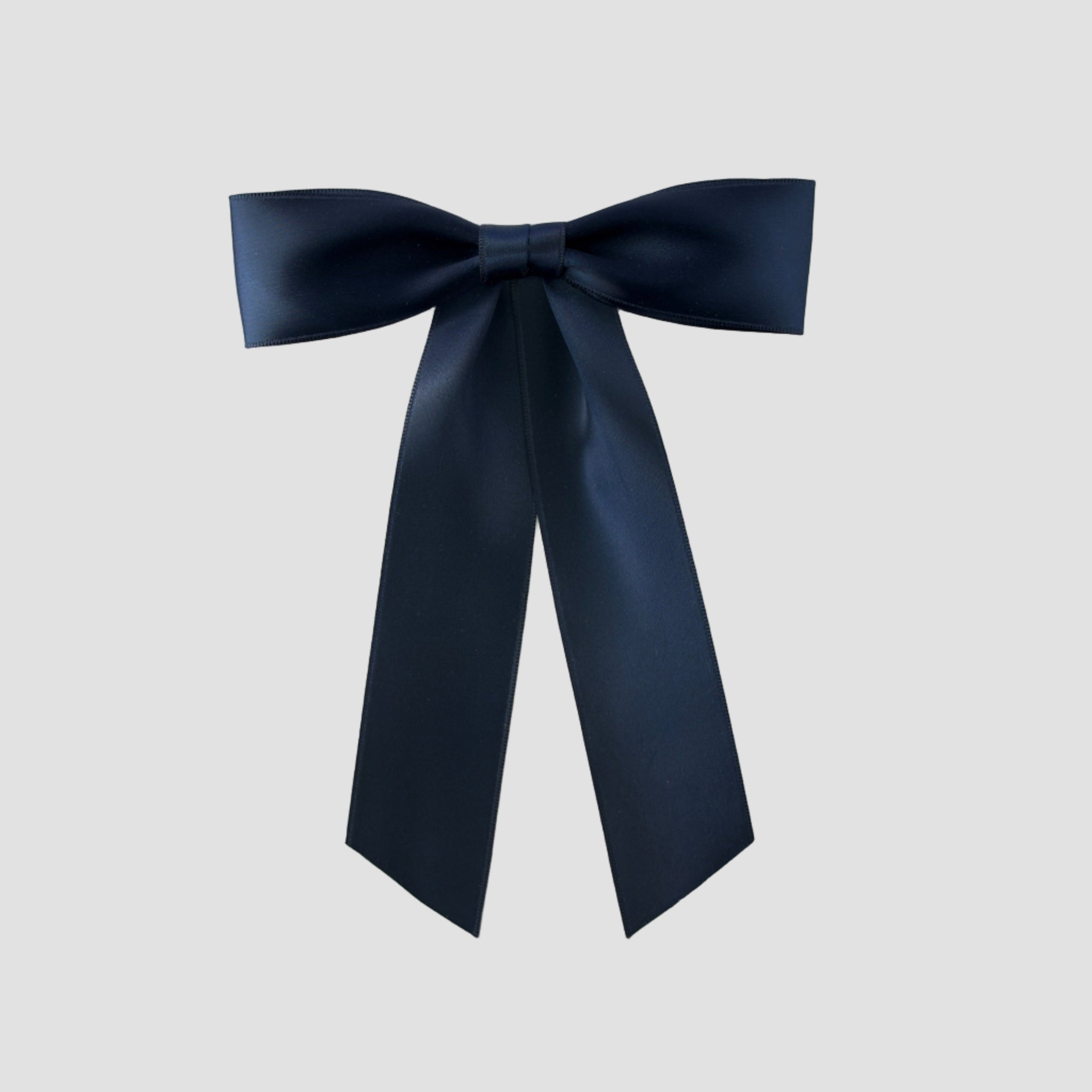 Navy Zoe petite satin hair bow on a white background