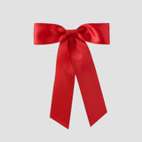 Red Zoe petite satin hair bow on a white background