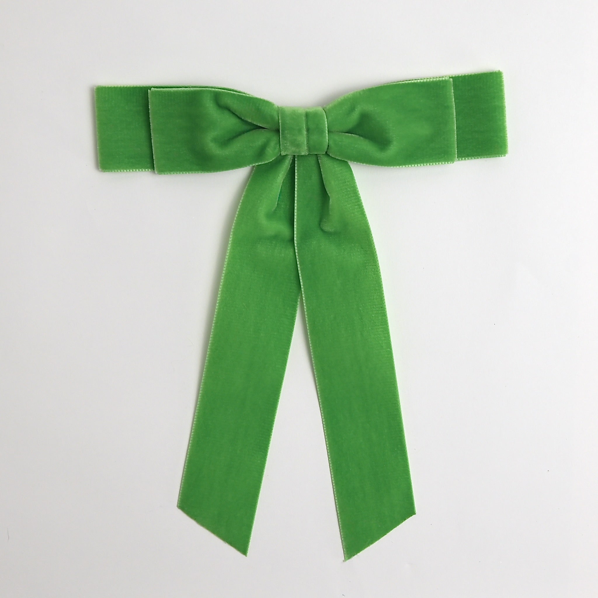Apple green Grace velvet hair bow for women. Double bow with long tails on white background 